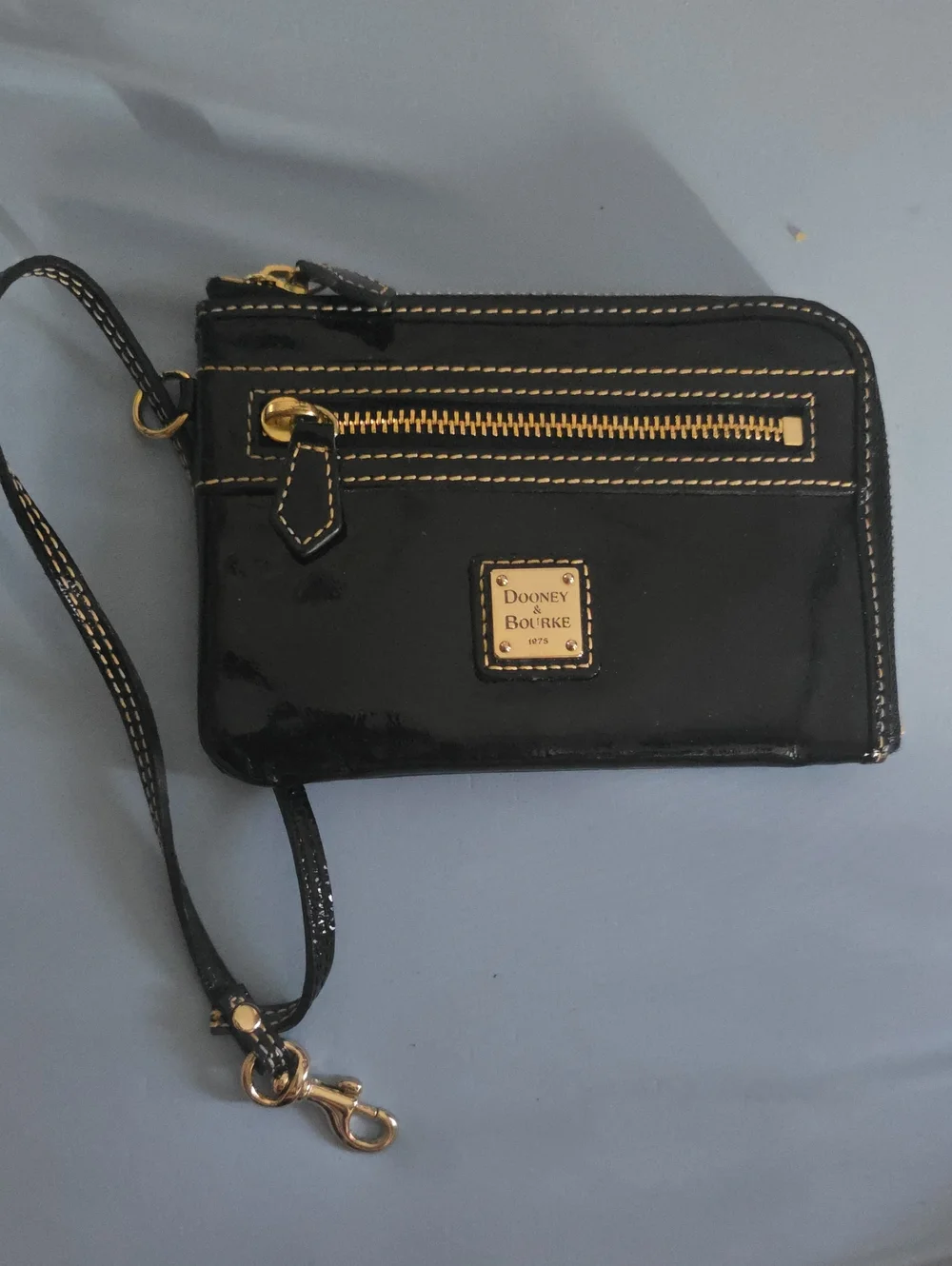 Dooney & Bourke Black Patent Leather Wristlet with Gold Hardware
